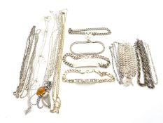 A collection of silver jewellery including bracelets, chains and necklaces