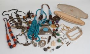A collection of costume jewellery including faux pearls, necklaces, brooches etc