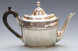 Georgian white metal teapot of oval form with engraved decoration, no visible silver marks but has