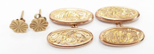 A pair of 9ct gold cufflinks by Georg Jensen with engraved foliate design (Birmingham 1902) and a