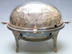 A silver plated food warmer with revolving lid, engraved decoration and two vacant cartouches,