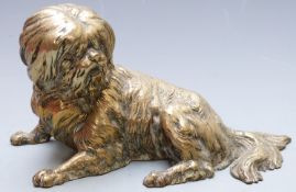 R. Bauchery signed brass or bronze study of a dog, length 18cm