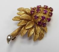 An 18ct gold brooch in the form of a stylised palm tree set with rubies with a diamond to the stem