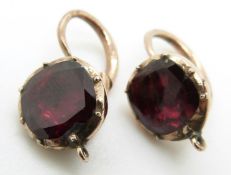 A pair of Victorian earrings set with foiled garnets