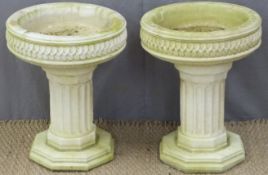 Pair of garden planters with octagonal bases, reeded columns and leaf decoration to top, height 48cm