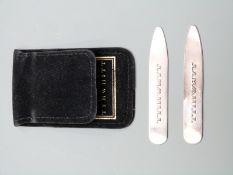 A pair of hallmarked silver Charles Tyrwhitt collar stiffeners in original slip case