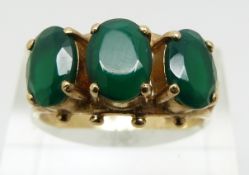 A 9ct gold ring set with green paste (size P)