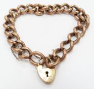 A 9ct rose gold curb link bracelet with 9ct gold heart padlock clasp, 26g
