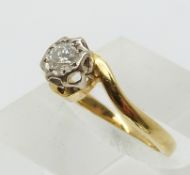 An 18ct gold ring set with a diamond of approximately 0.2ct in a platinum setting (size J)