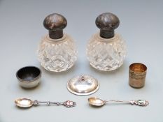A pair of George V hallmarked silver mounted cut glass dressing table bottles, Sheffield 1915