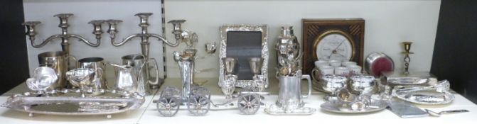A collection of plated ware including pair of candelabra, cocktail shaker, cutlery, tankards, silver