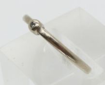 A 14ct white gold ring set with a diamond (size M/N)