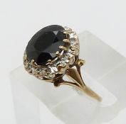 A 9ct gold ring set with a sapphire and diamonds (size L)