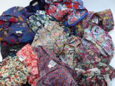 Approximately 11 vintage Liberty floral print dresses, similar skirt and a purple jacket