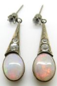 A pair of Art Deco earrings set with opal cabochons and paste