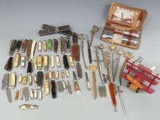A collection of penknives and letter openers, wooden Red Baron model aeroplane etc