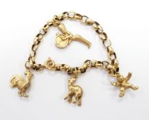 A yellow metal bracelet with gold plated charms