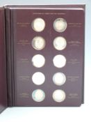 Album of 60 hallmarked silver medallions depicting classical artwork including frescoes,