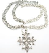 A white metal necklace and pendant
