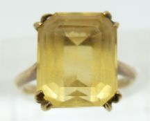 A 9ct gold ring set with an emerald cut citrine, 3.7g (size K)