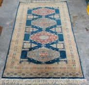 Small rug with blue and cream ground