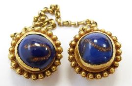 A pair of Victorian studs set with sunstone/ glass cabochons