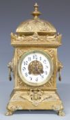 Japy Freres late 19thC brass mantel clock in ornate brass case with lion masked cherub decoration,