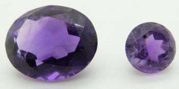 An oval cut amethyst of approximately 3.88ct and a round cut amethyst of approximately 1ct