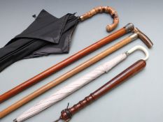 Two walking canes, one malacca with white metal embossed knop the other with Edward VII hallmarked