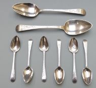 Two Georgian hallmarked silver bright cut table spoons, one Exeter 1819 the other with indistinct