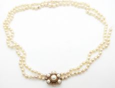 A double strand of cultured pearls with 9ct gold clasp