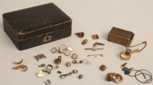 An 18ct gold cufflink (5.5g), 9ct gold brooch (1.2g), two sections of Victorian rings (3.2g), a pair