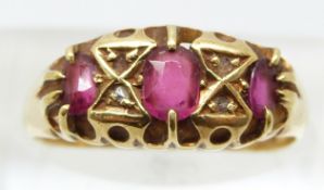 Victorian 18ct gold ring set with three rubies and four diamonds, Birmingham 1890 (size N)
