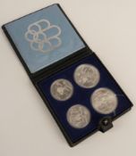 Montreal Olympics cased silver four coin set comprising two ten dollar coins and two five dollar