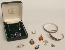 A collection of silver jewellery including an Edwardian cross (Birmingham 1902), two silver bangles,