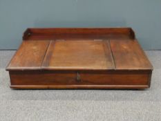 19thC or early 20thC oak clerk's desk the lift up flap with two drawers and cubby holes inside,