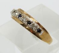 A 9ct gold ring set with sapphires and diamonds (size O)