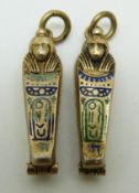 Two Egyptian charms each depicting a sarcophagus with mummy