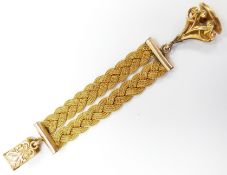 A yellow metal Albert/fob with woven strand and swing fob