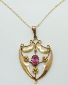 A 9ct gold pendant set with pink topaz on a 9ct gold chain, 2.7g