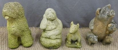 Four garden models of animals comprising two dogs, gorilla and pigs, height of tallest 36cm