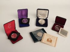 Five cased USA and Canada commemorative coins, includes silver