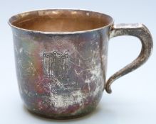 White metal cup marked to base International Sterling, height 6.5cm, weight 117g