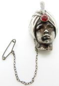 A hallmarked silver brooch in the form of a blackamoor figure, London 1947