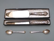 Two boxed hallmarked silver handled King's pattern knives and two hallmarked silver spoons, weight