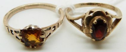 A 9ct gold ring set with a citrine and a 9ct gold ring set with a garnet
