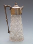 Victorian hallmarked silver and cut glass claret jug, the handle with lion or dragons mouth,