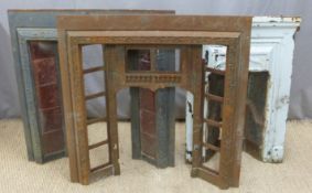 Three various cast iron fire place surrounds
