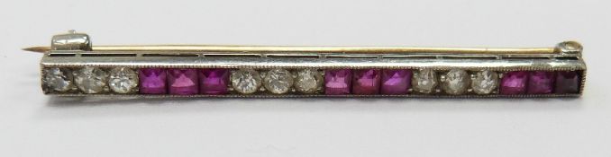 Art Deco gold and platinum brooch set with round cut diamonds and square cut rubies, width 4cm x