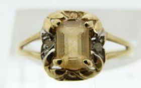 A 9ct gold ring set with citrine and diamonds (size O)